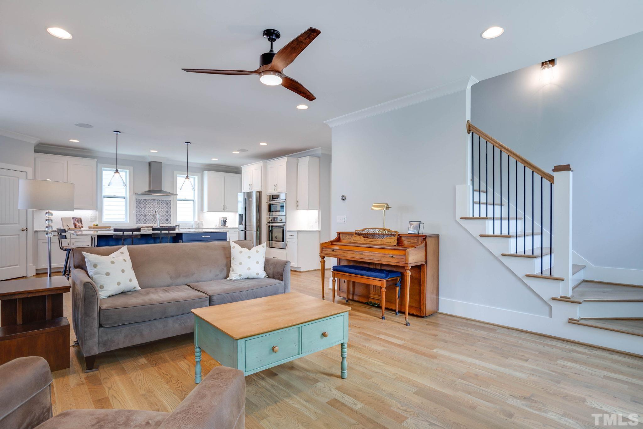 1702 Bickett Boulevard Raleigh, NC 27608 - Photo 16 of 41 a living room with furniture and a wooden floor