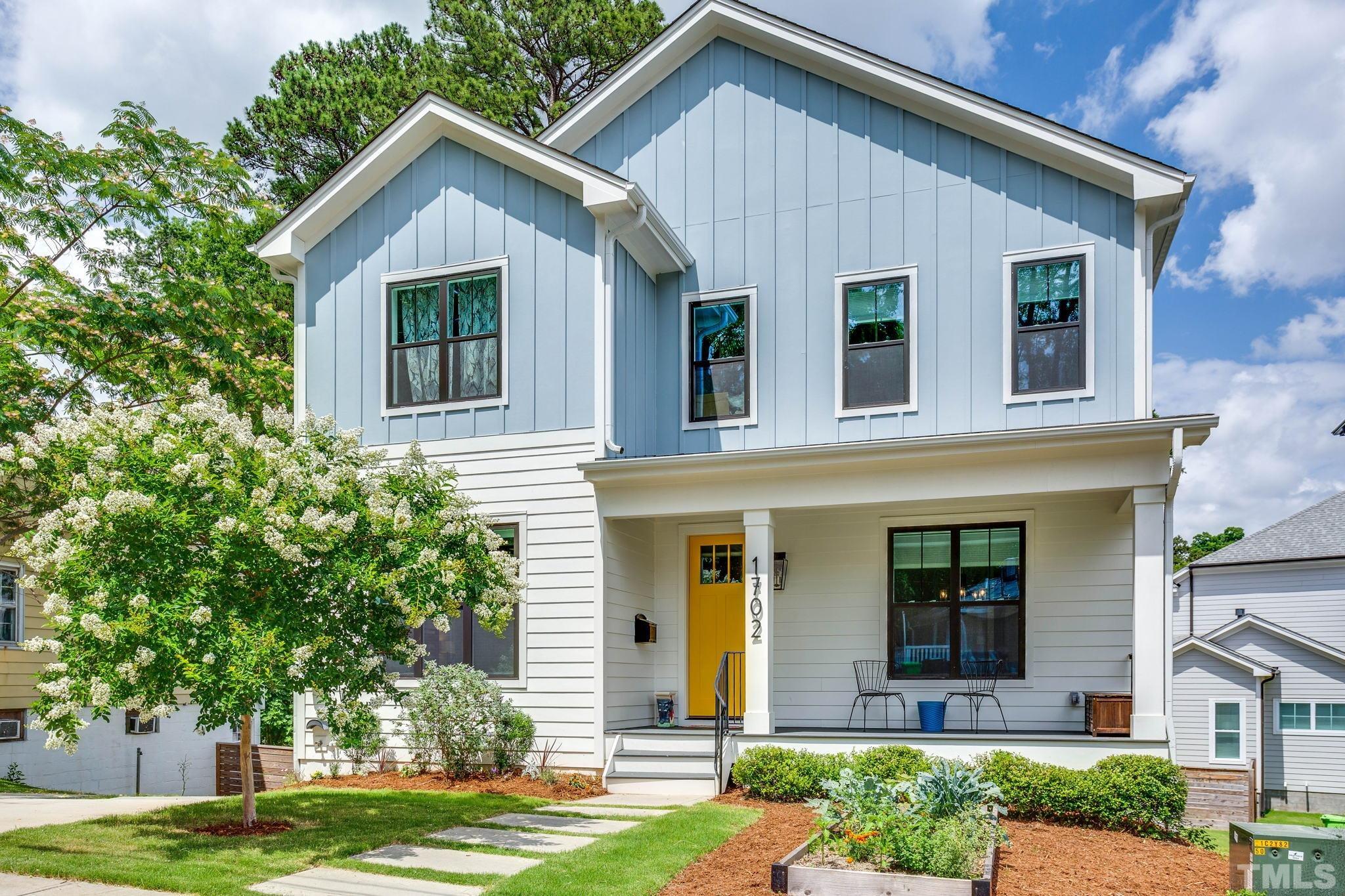 1702 Bickett Boulevard Raleigh, NC 27608 - Photo 2 of 41 front view of a house with a yard