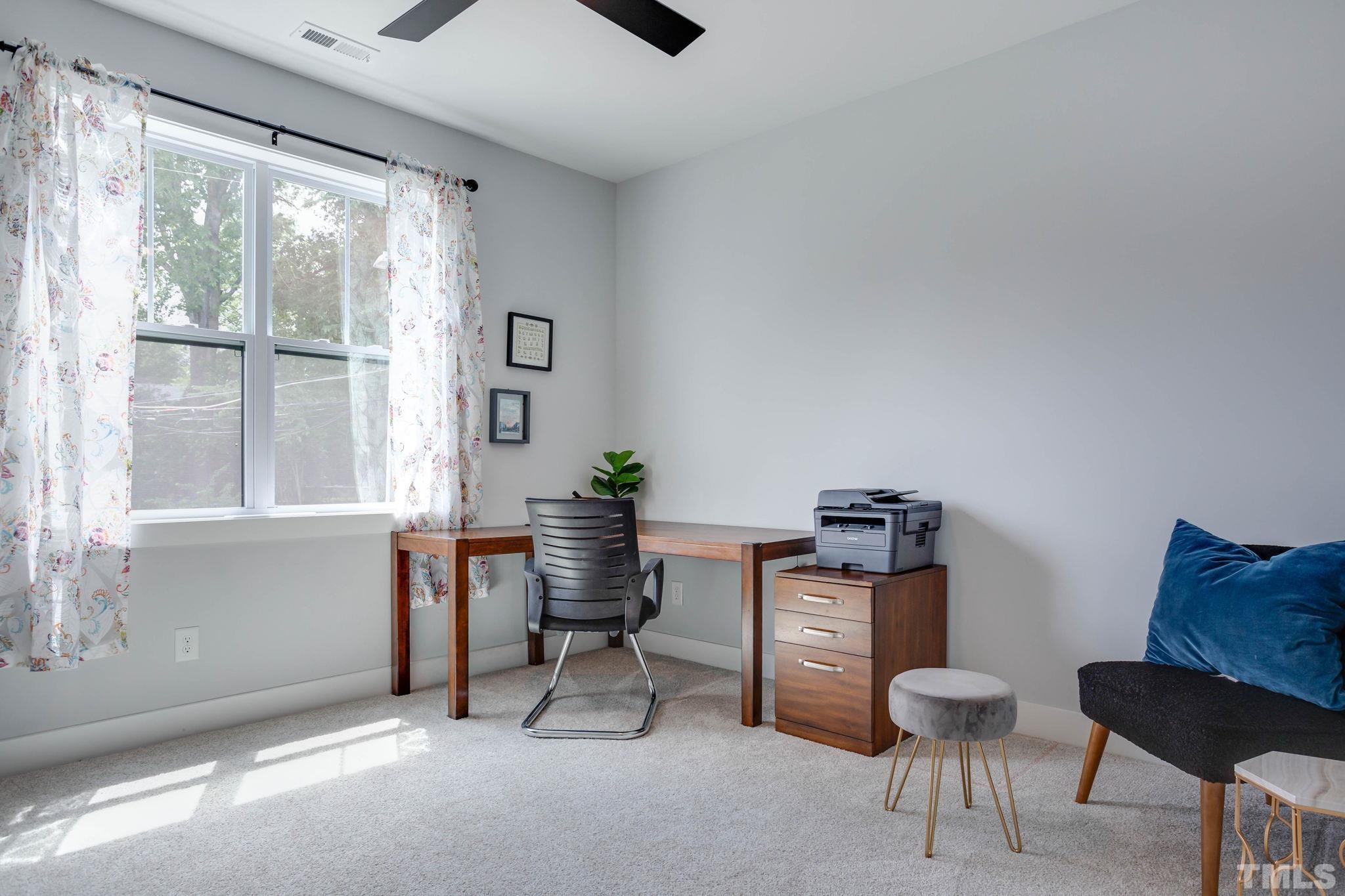 1702 Bickett Boulevard Raleigh, NC 27608 - Photo 25 of 41 a workspace with furniture and a window