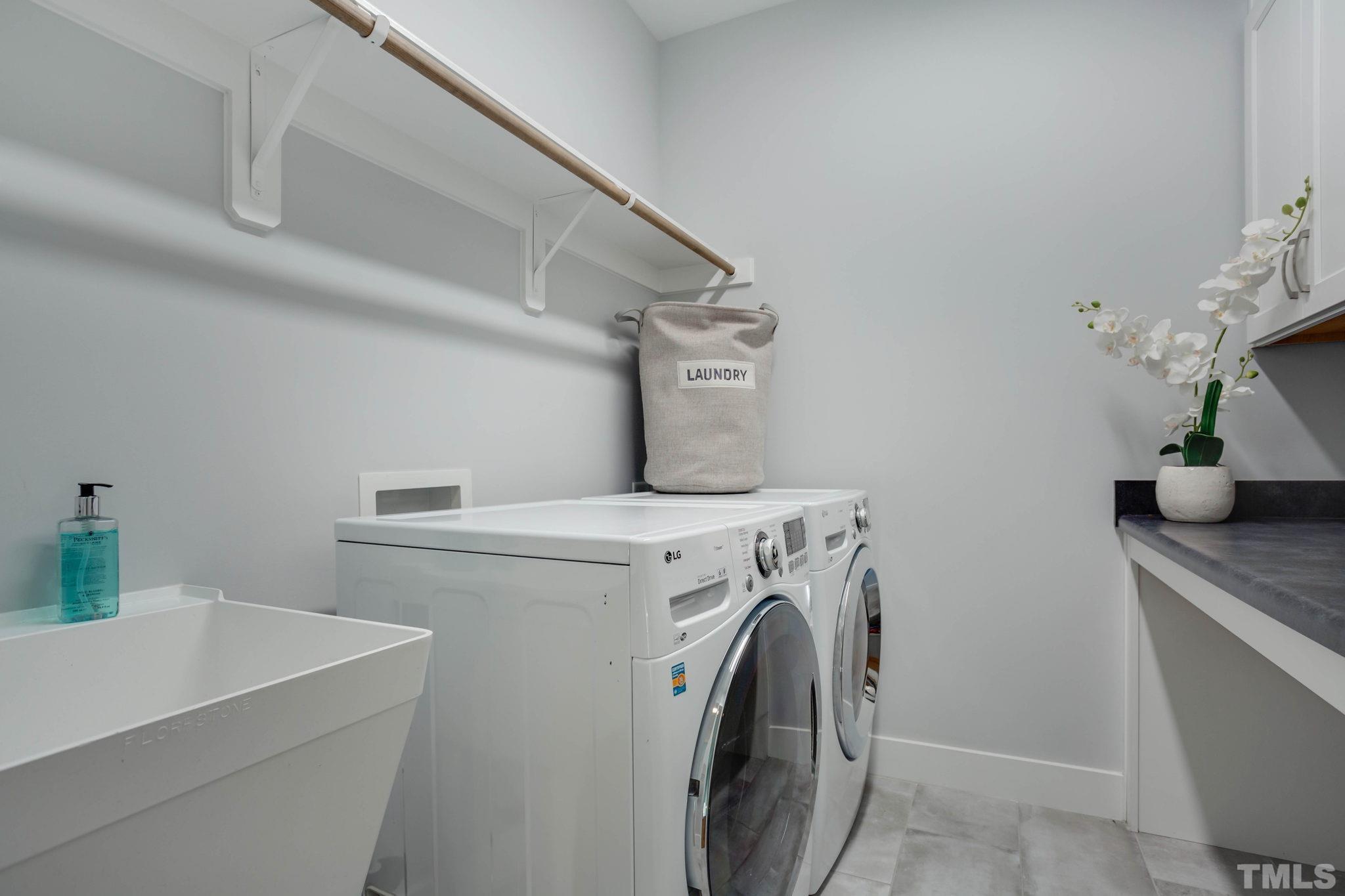 1702 Bickett Boulevard Raleigh, NC 27608 - Photo 27 of 41 a utility room with dryer and washer