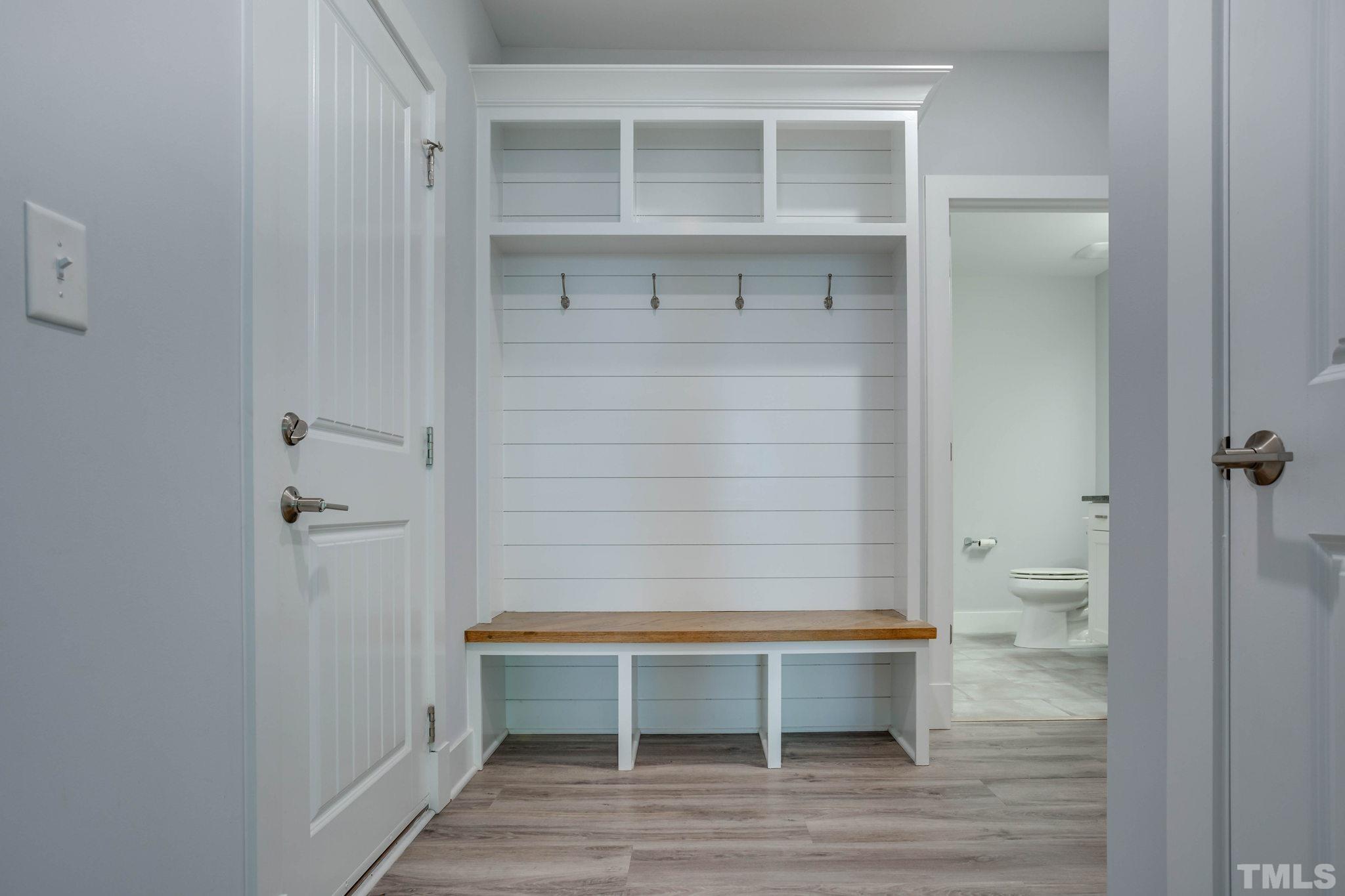1702 Bickett Boulevard Raleigh, NC 27608 - Photo 31 of 41 a bathroom with a wooden floor and toilet