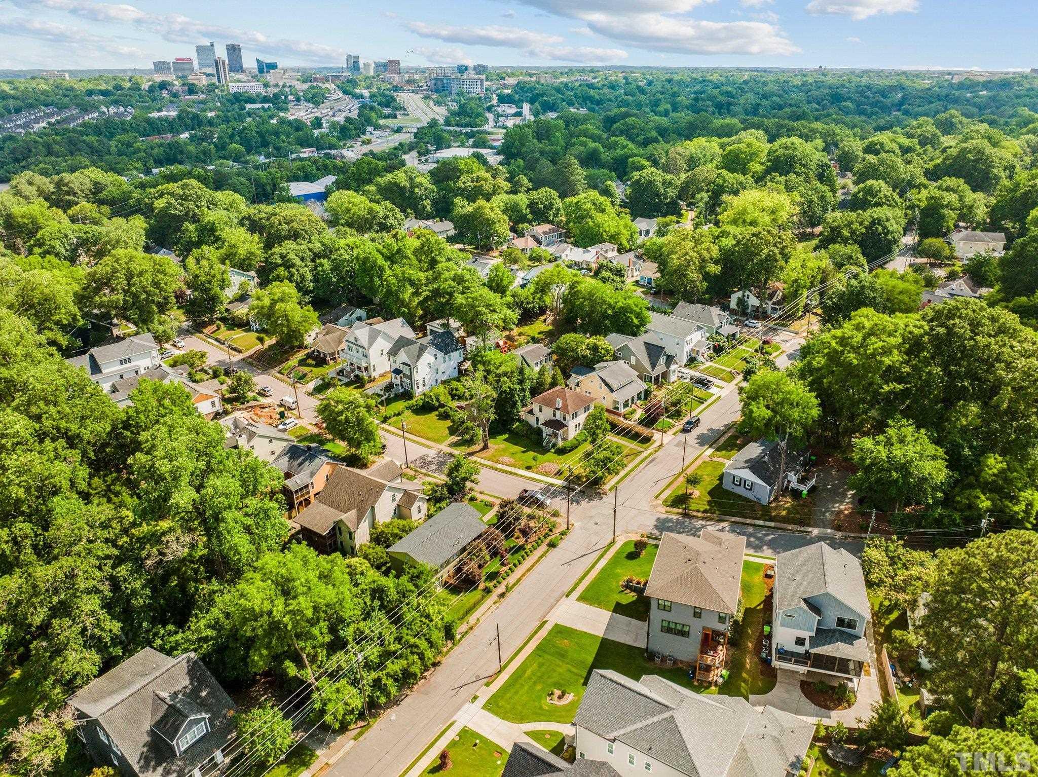 1702 Bickett Boulevard Raleigh, NC 27608 - Photo 4 of 41 an aerial view of residential houses with outdoor space