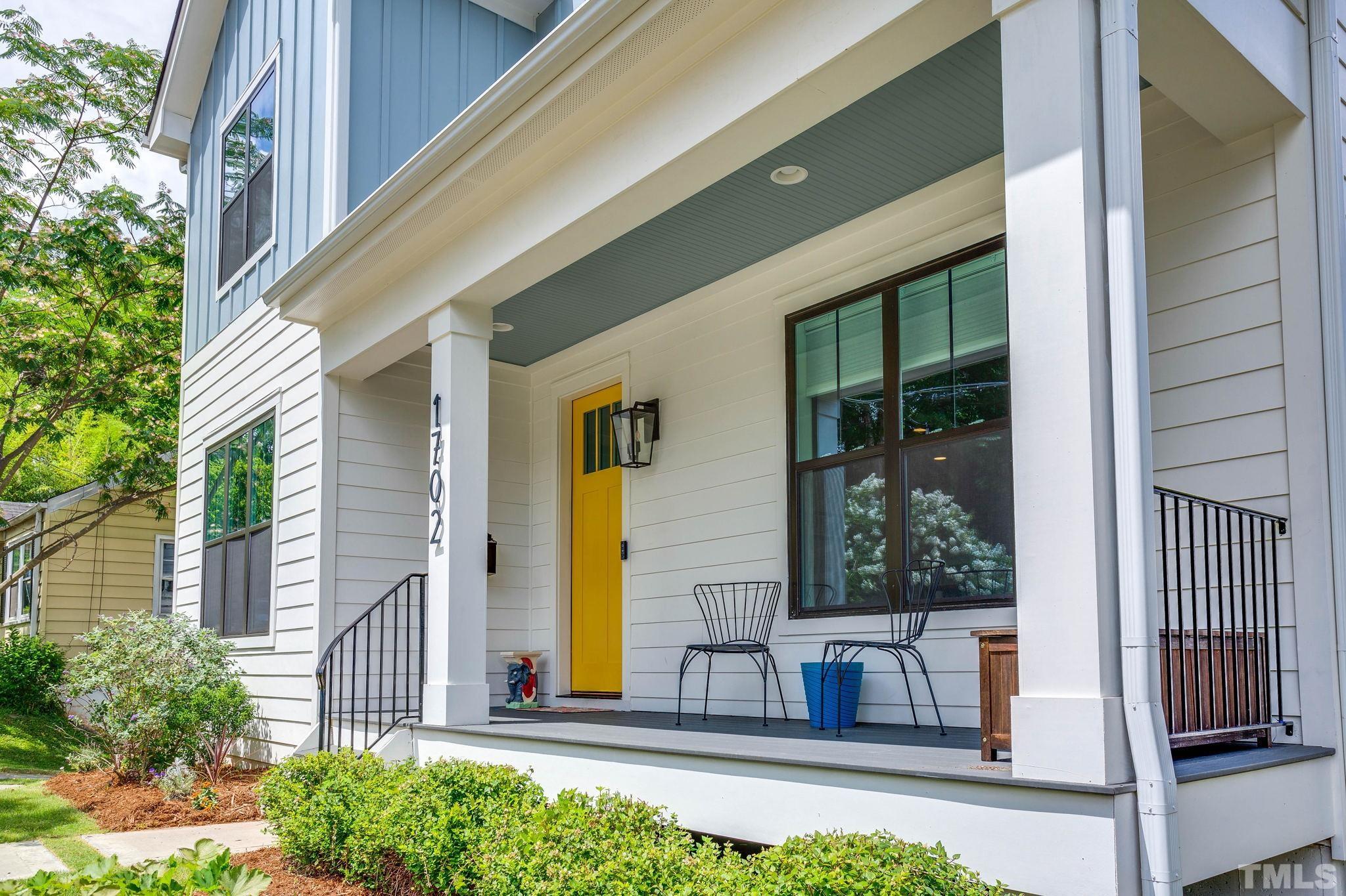 1702 Bickett Boulevard Raleigh, NC 27608 - Photo 5 of 41 a front view of a house with a garden
