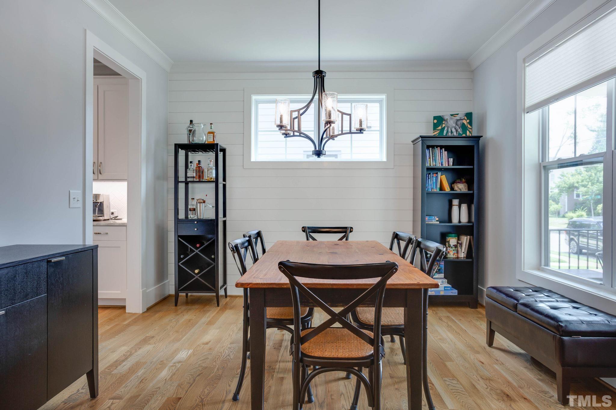 1702 Bickett Boulevard Raleigh, NC 27608 - Photo 6 of 41 a view of a dining room with furniture window and wooden floor