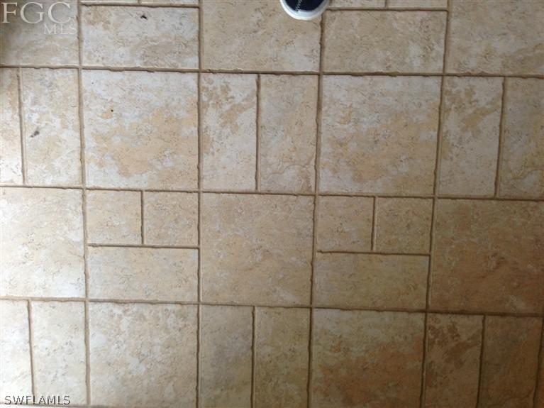 348 Rancho Avenue Lehigh Acres, FL 33974 - Photo 4 of 10 a bathroom with a shower