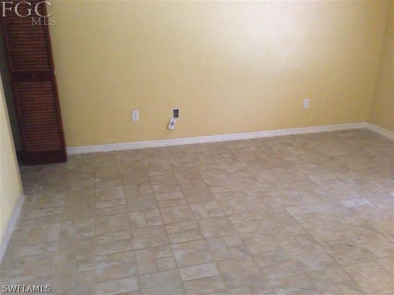 348 Rancho Avenue Lehigh Acres, FL 33974 - Photo 8 of 10 a view of an empty room