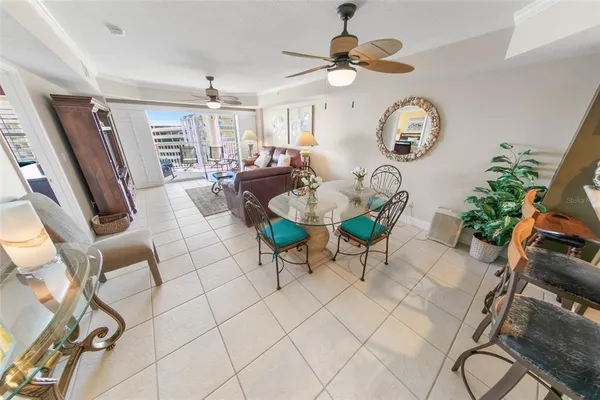 a living room filled with furniture and a chandelier