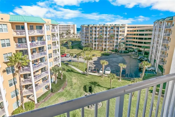 a view of swimming pool from a balcony
