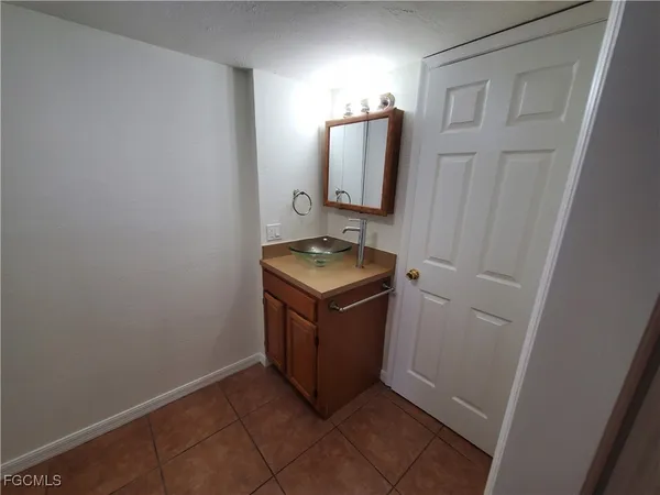 a white toilet sitting next to a shower