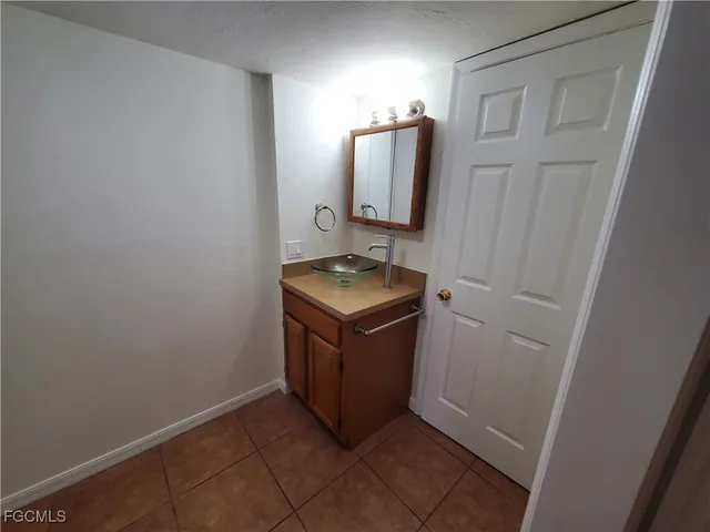 a white toilet sitting next to a shower