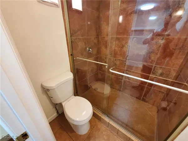 a utility room with sink dryer and washer
