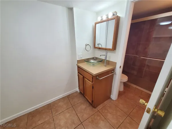 a kitchen with a cabinets and white appliances