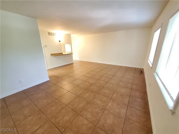 a view of an empty room and window