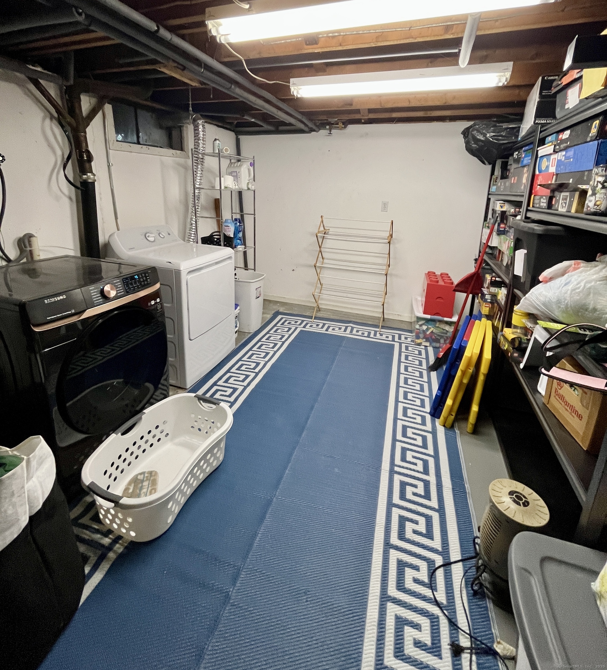 12 Post Road Enfield, CT 06082 - Photo 12 of 15 a view of walk in closet with clothes and shoes