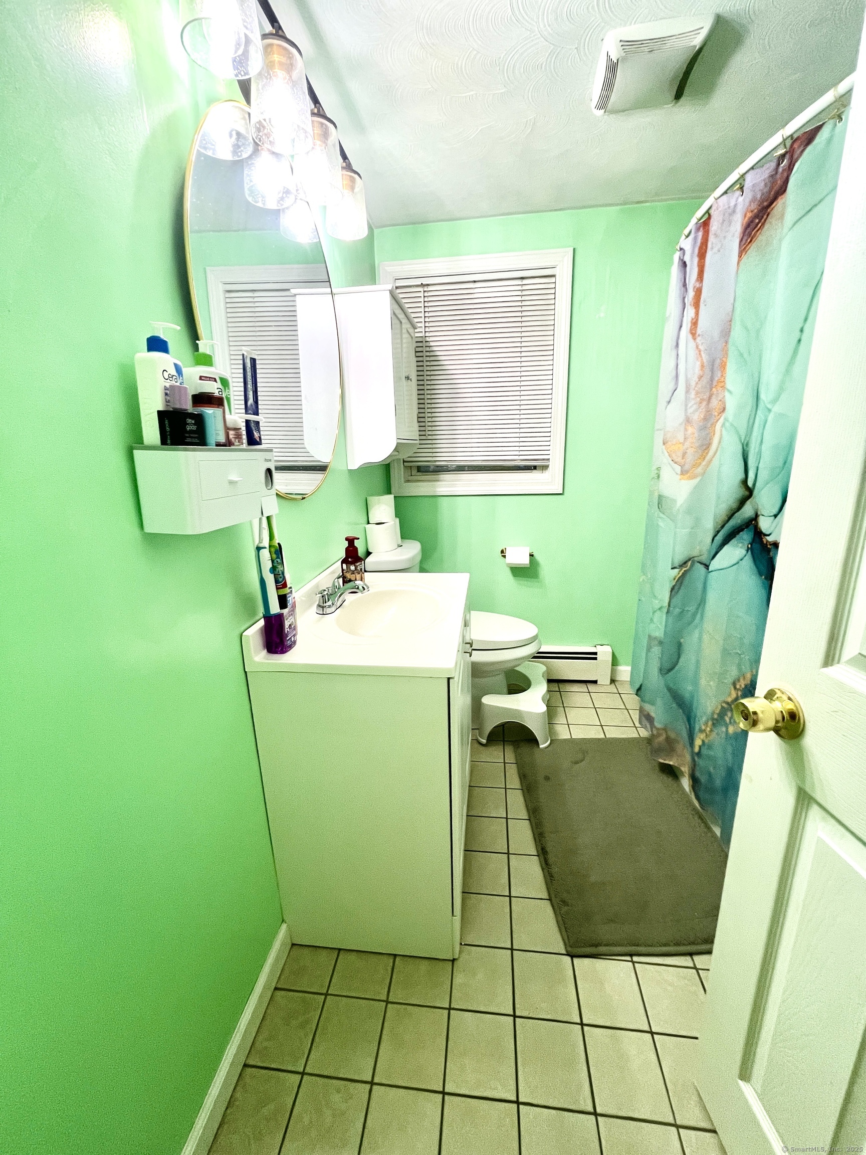 12 Post Road Enfield, CT 06082 - Photo 7 of 15 a room with sink mirror and furniture