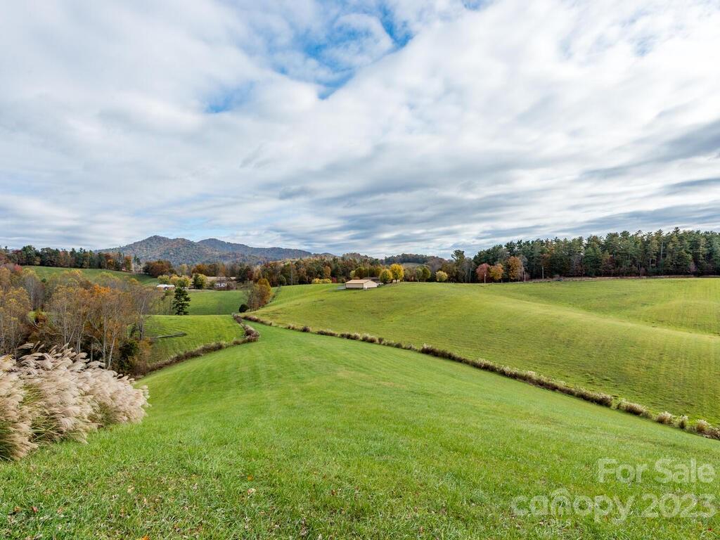 264 Hazel Brook Road Marshall, NC 28753 - Photo 11 of 47 a view of a lake with houses in the back