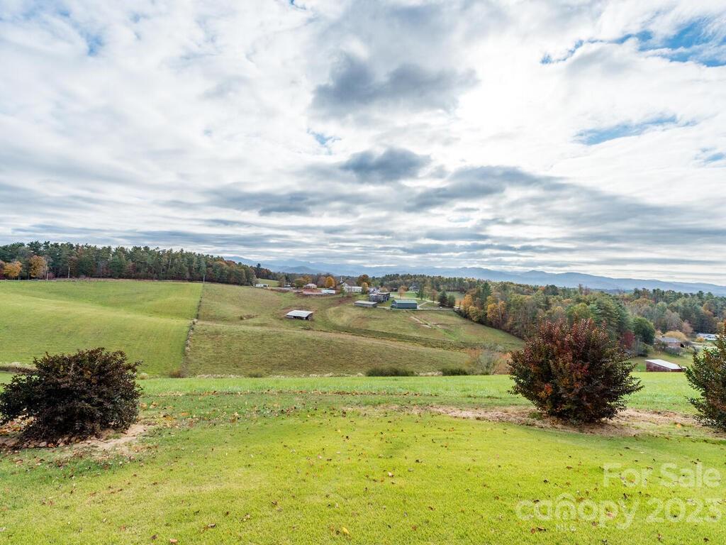 264 Hazel Brook Road Marshall, NC 28753 - Photo 12 of 47 a view of a lake with a big yard