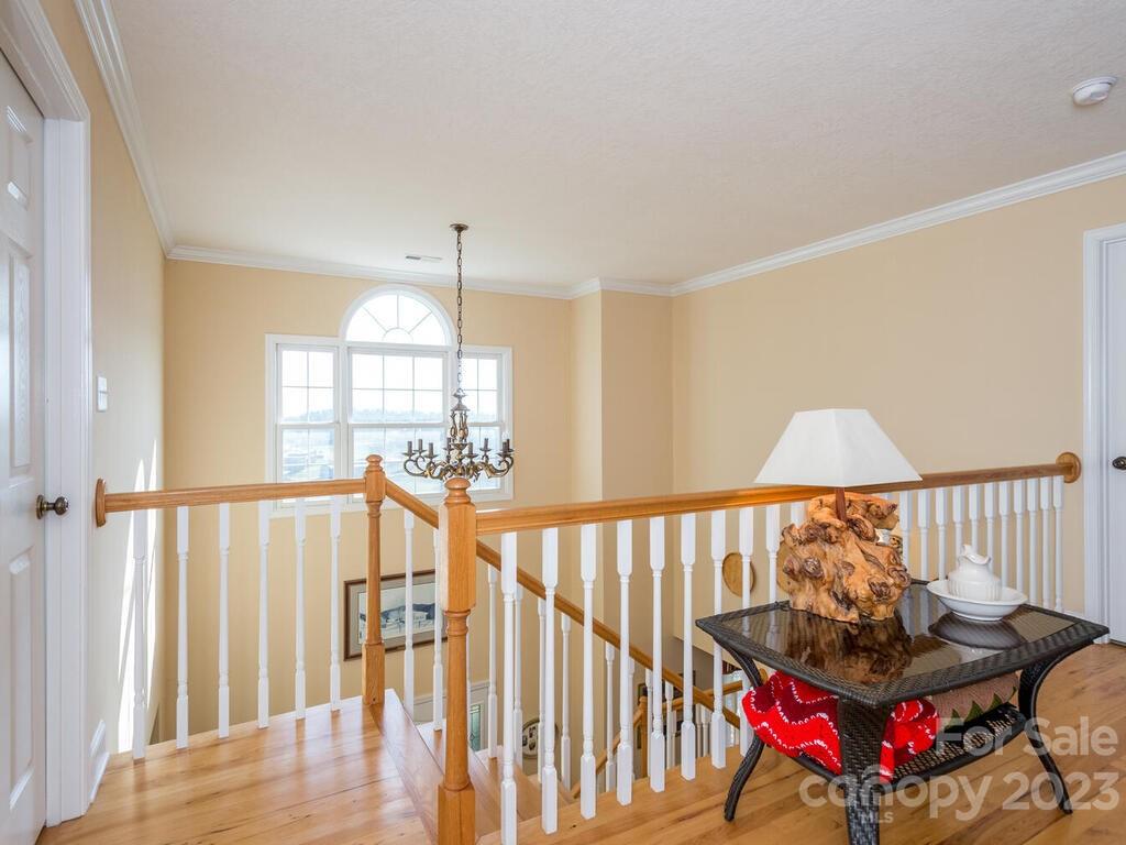 264 Hazel Brook Road Marshall, NC 28753 - Photo 29 of 47 a living room with furniture and a wooden floor