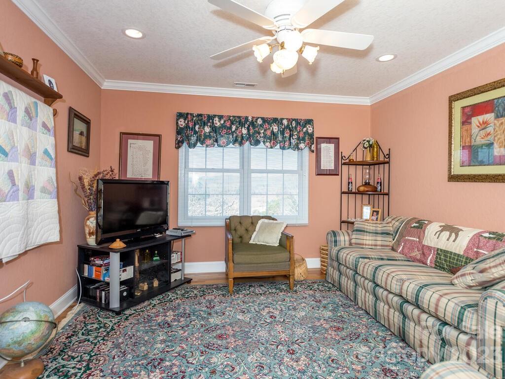 264 Hazel Brook Road Marshall, NC 28753 - Photo 30 of 47 a living room with furniture and a flat screen tv