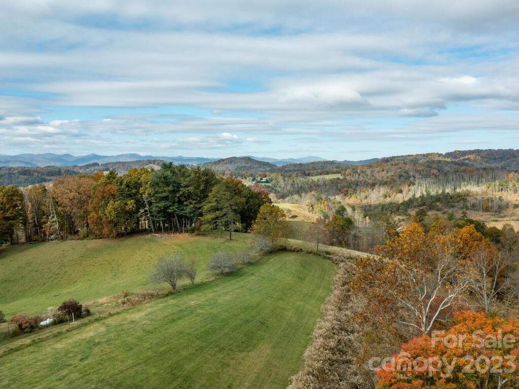 264 Hazel Brook Road Marshall, NC 28753 - Photo 39 of 47 a view of a lake with a city