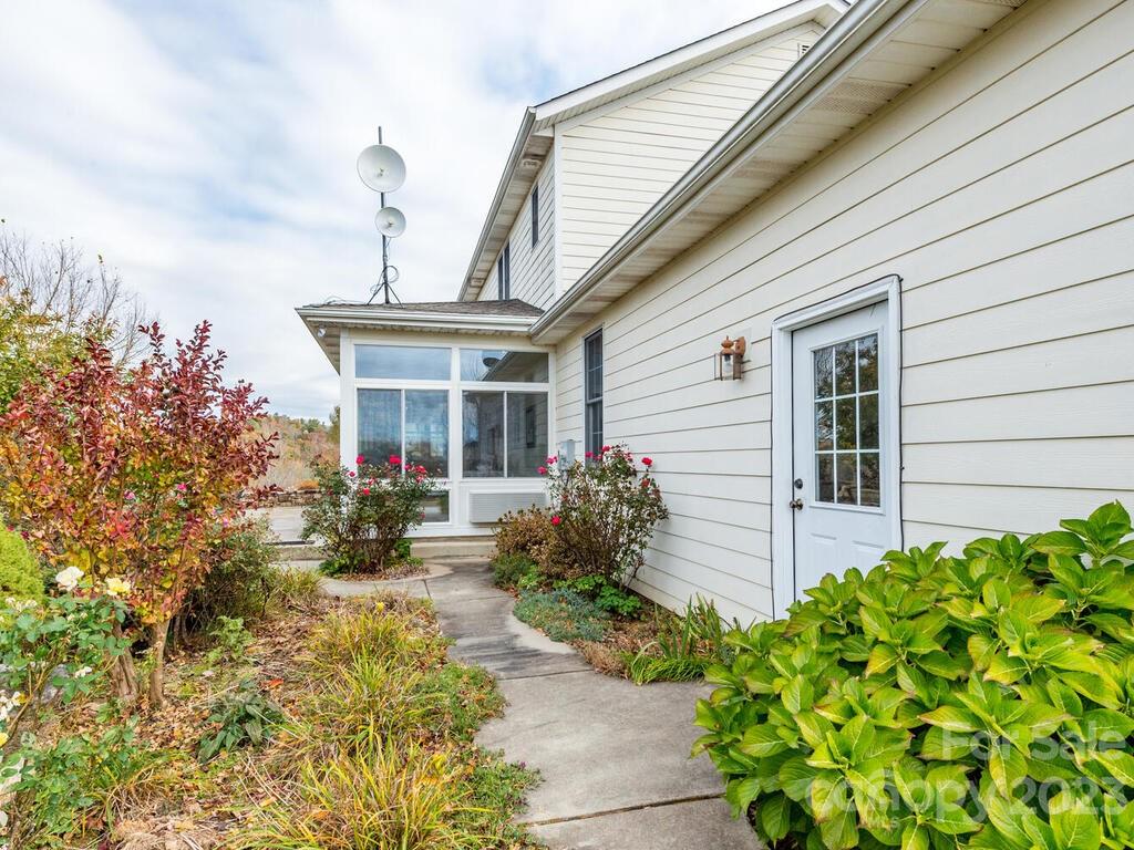 264 Hazel Brook Road Marshall, NC 28753 - Photo 7 of 47 a front view of a house with garden