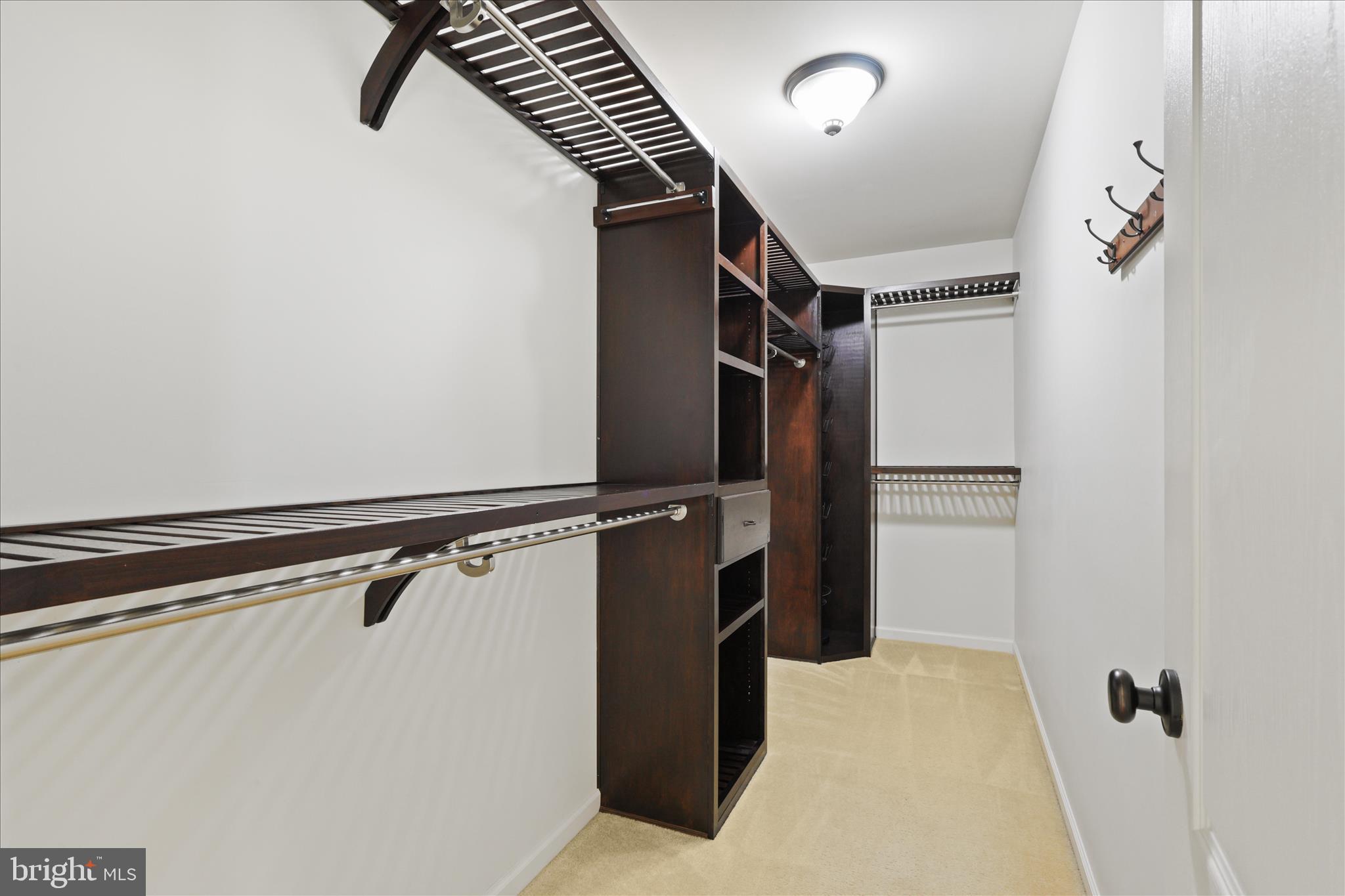 15221 Londons Bridge Road Haymarket, VA 20169 - Photo 14 of 43 a view of walk in closet with clothes and shoes