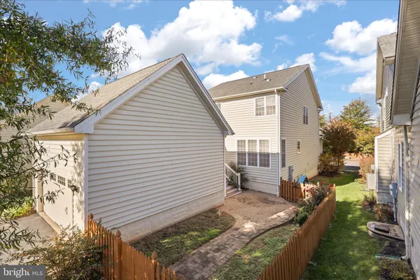 a view of house with backyard