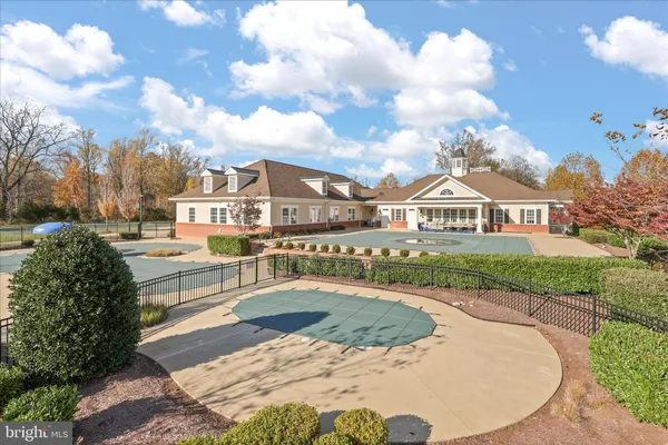 a view of a house with tub and trees around