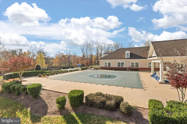a view of a swimming pool with a yard