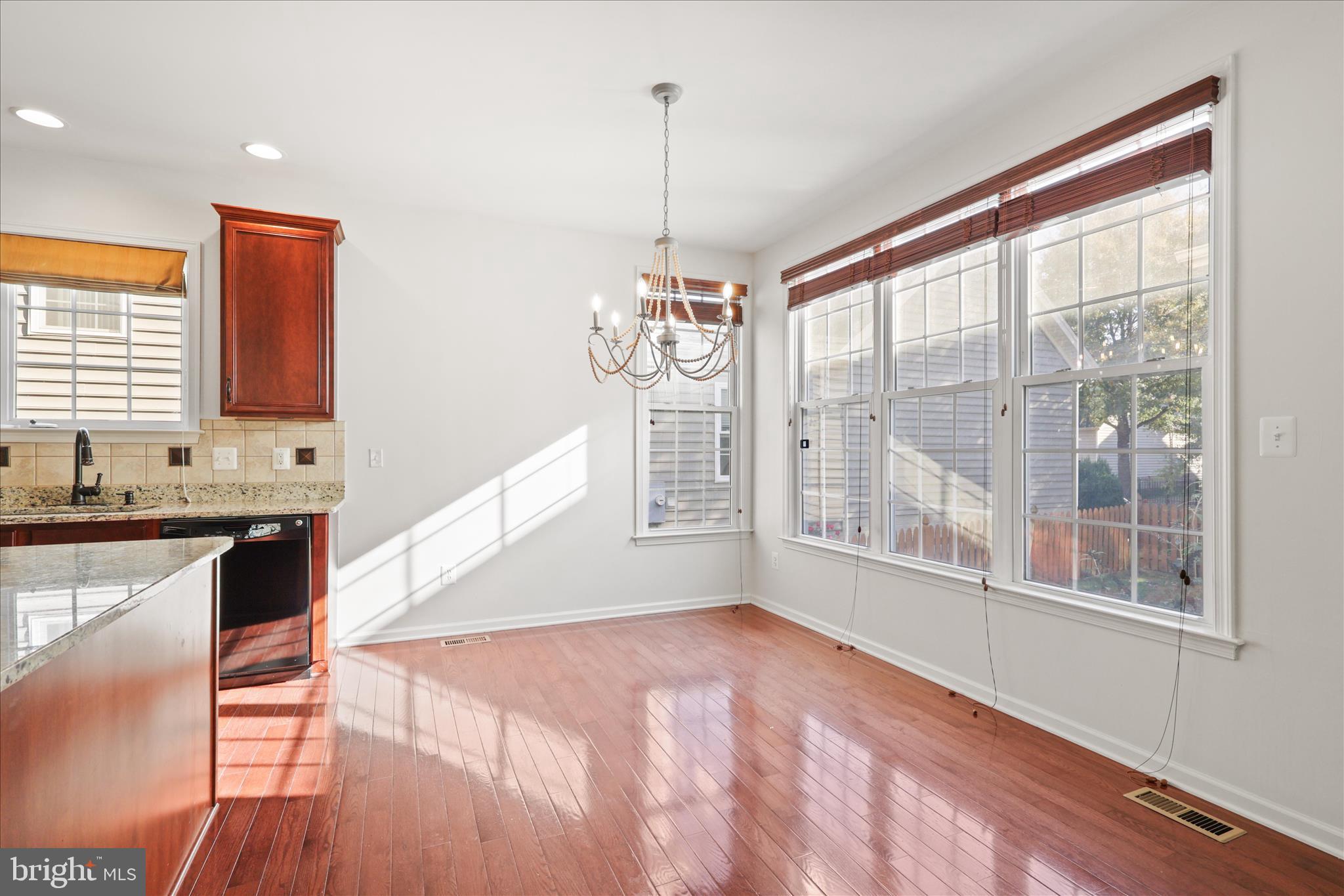 15221 Londons Bridge Road Haymarket, VA 20169 - Photo 8 of 43 a view of a kitchen with wooden floor and a window