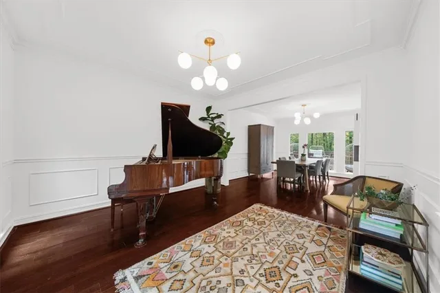 a kitchen with white cabinets and appliances