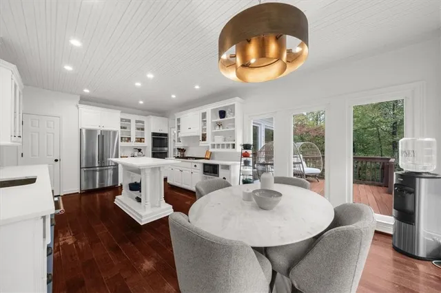 a spacious bathroom with a bathtub and sink