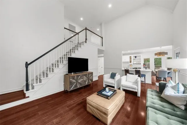 a bedroom with a bed chair and a window