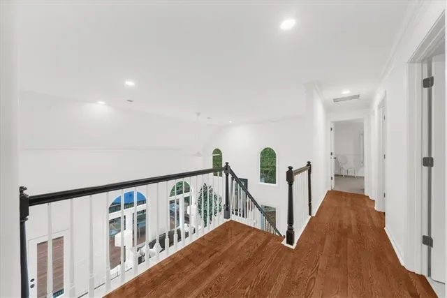 a view of a livingroom with furniture and a ceiling fan