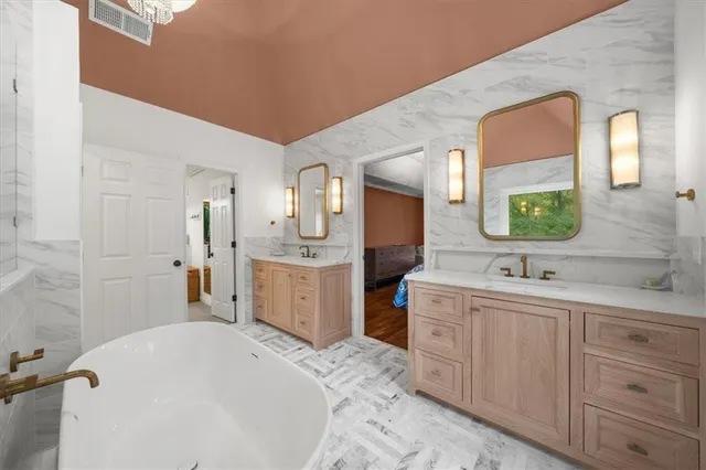 a view of a house with backyard porch and sitting area