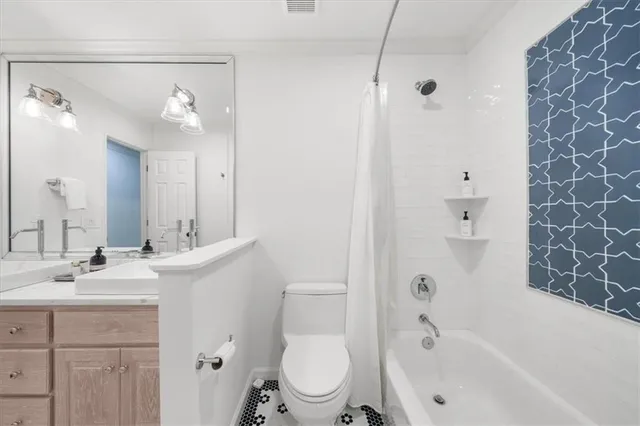 a view of a swimming pool with a patio