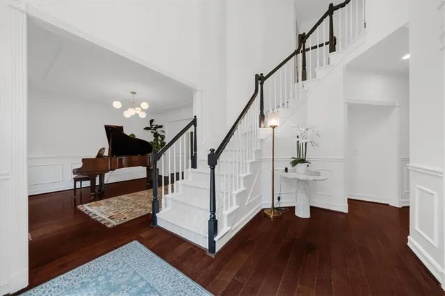 a large kitchen with stainless steel appliances lots of counter space and wooden floor