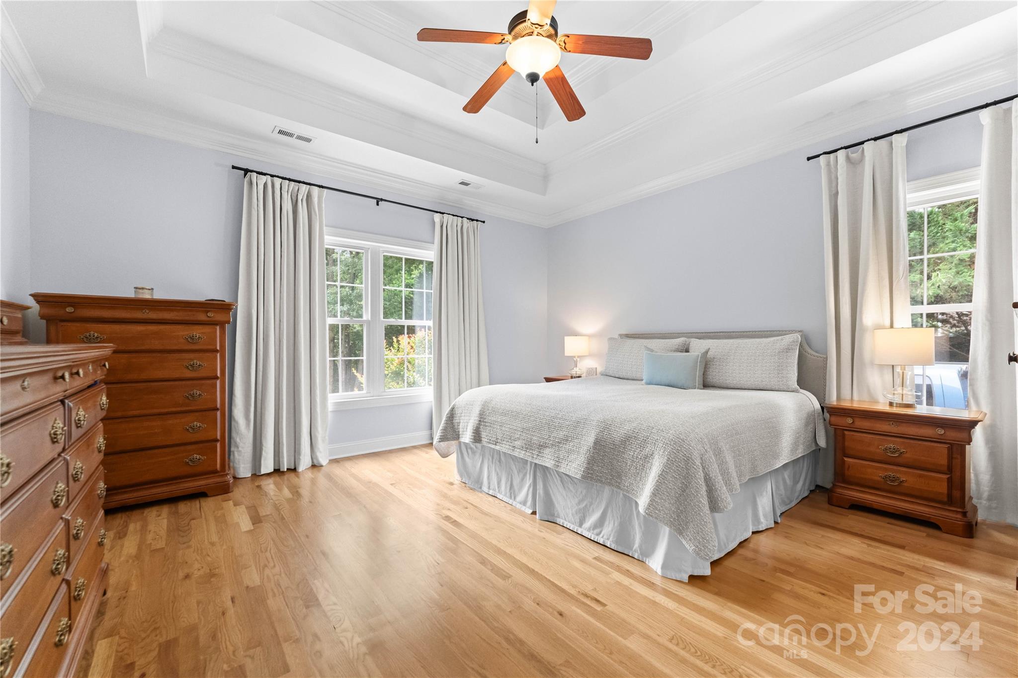 5888 Johnson Road Clover, SC 29710 - Photo 16 of 44 a bedroom with a bed and a chandelier
