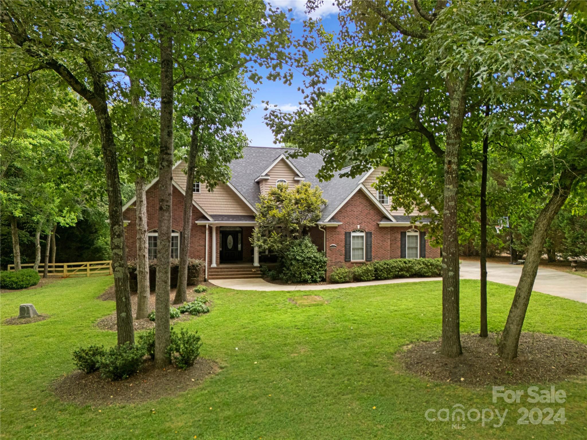 5888 Johnson Road Clover, SC 29710 - Photo 2 of 44 a front view of a house with garden
