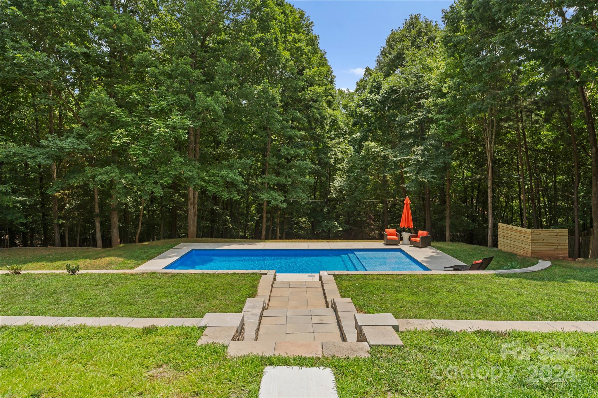 5888 Johnson Road Clover, SC 29710 - Photo 34 of 44 a view of yard with swimming pool and wooden fence