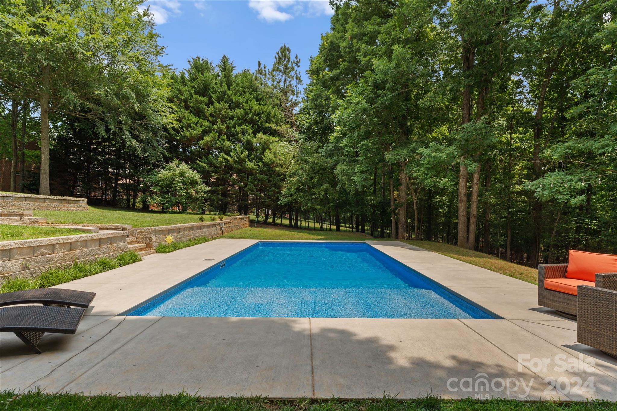 5888 Johnson Road Clover, SC 29710 - Photo 37 of 44 a view of a swimming pool with a lounge chair