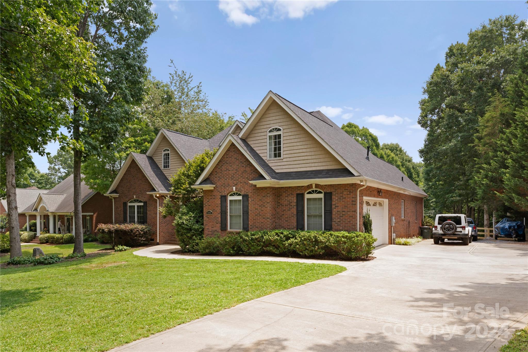 5888 Johnson Road Clover, SC 29710 - Photo 4 of 44 a front view of a house with a garden and plants