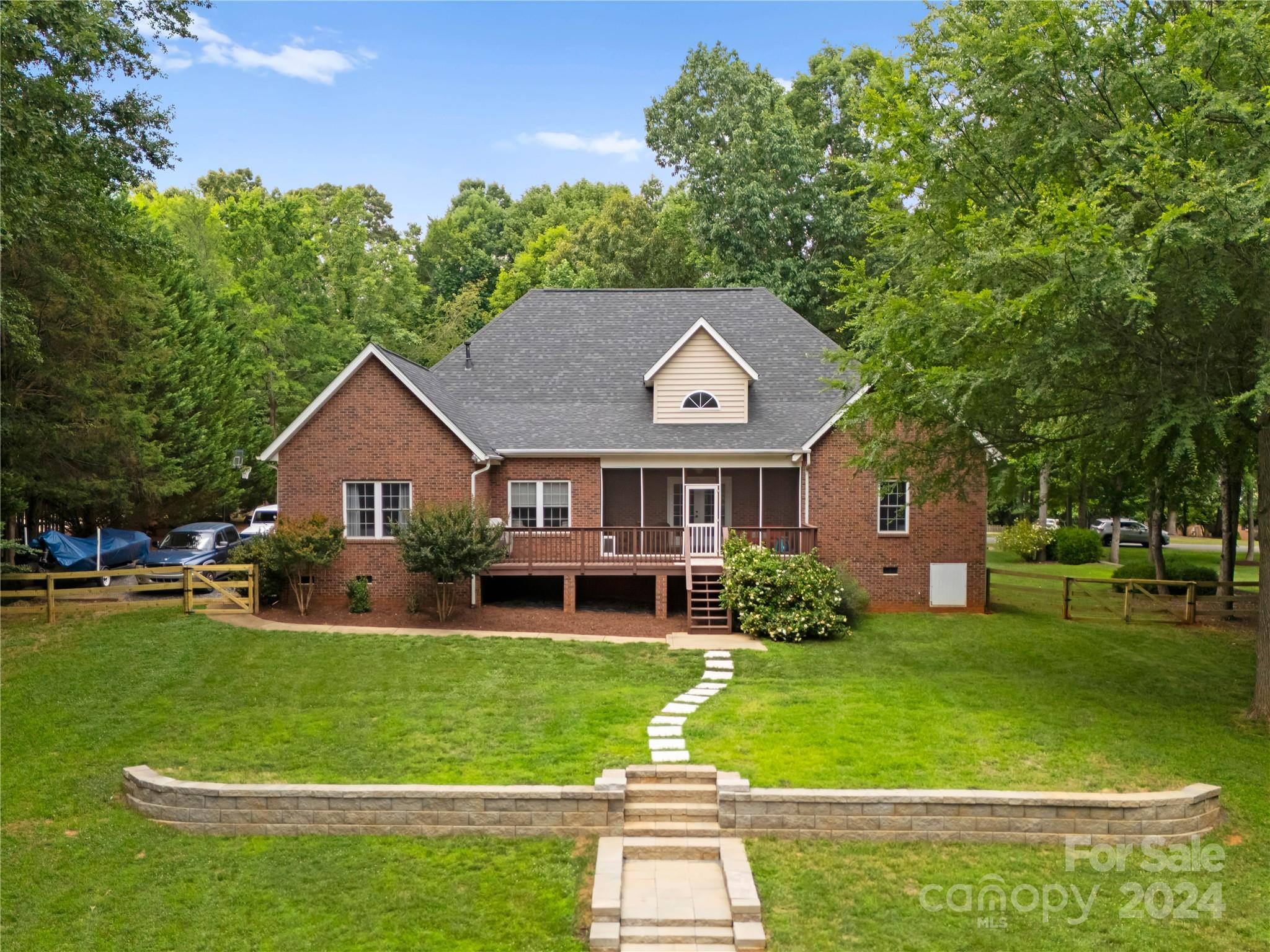 5888 Johnson Road Clover, SC 29710 - Photo 43 of 44 a front view of a house with garden and trees
