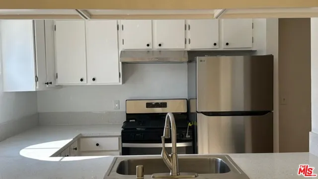 a view of a sink and a mirror