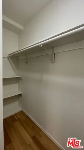 a bathroom view of a toilet and a shower