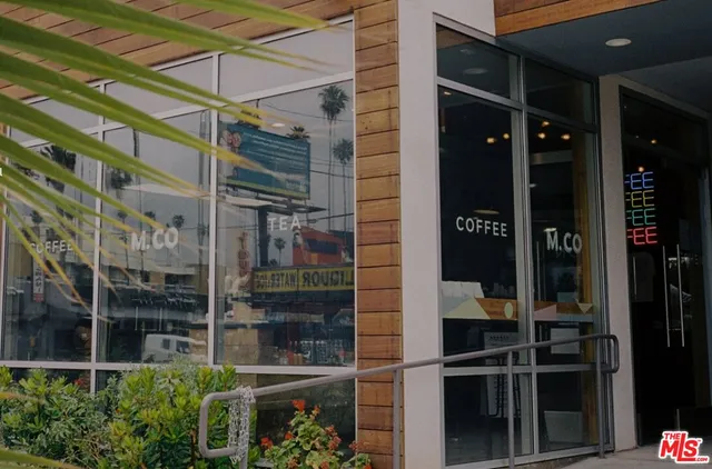 a view of a street with shops