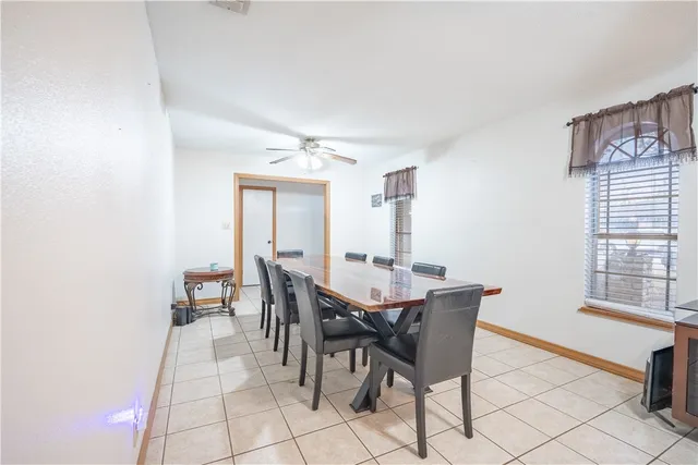 a view of a dining room with furniture and window