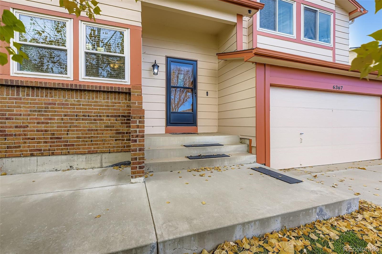 6367 Xavier Street Arvada, CO 80003 - Photo 4 of 37 a front view of a house