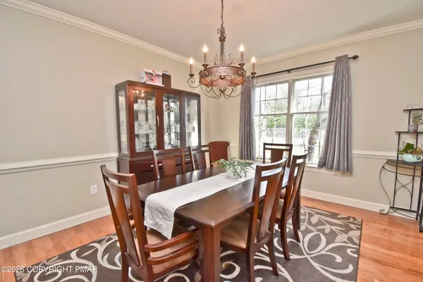 a kitchen with a dining table chairs and living room