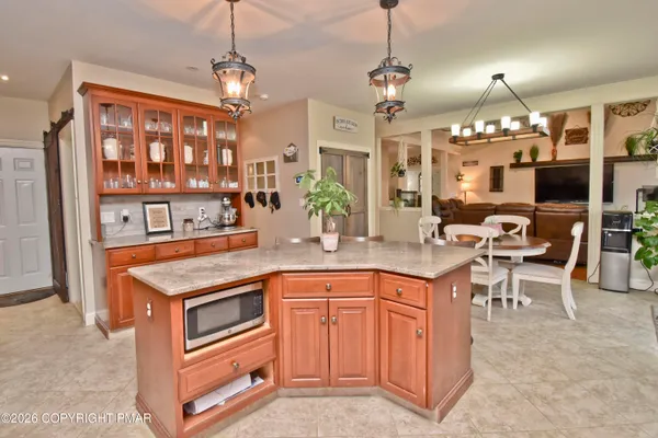 a living room with furniture a rug and a window